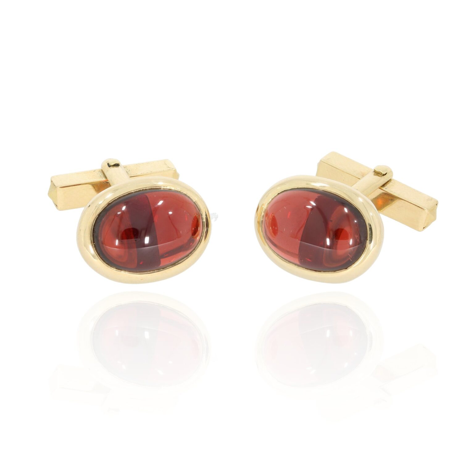 Gold cuff links garnet